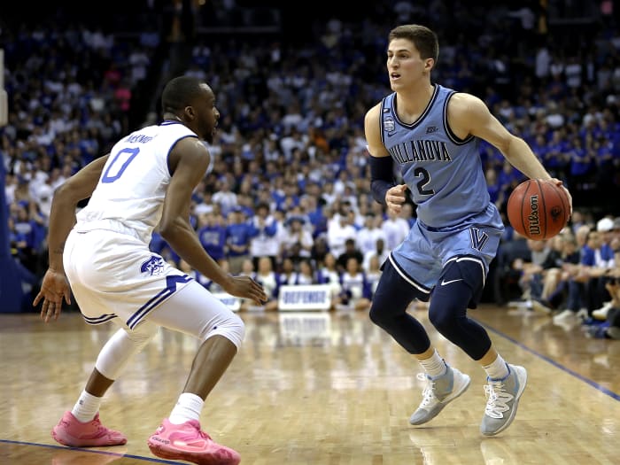 March 4, 2020; Newark, New Jersey, USA; Villanova Wildcats guard Collin Gillespie (2) dribbles against Seton Hall Pirates guard Quincy McKnight (0) during the first half at Prudential Center.
